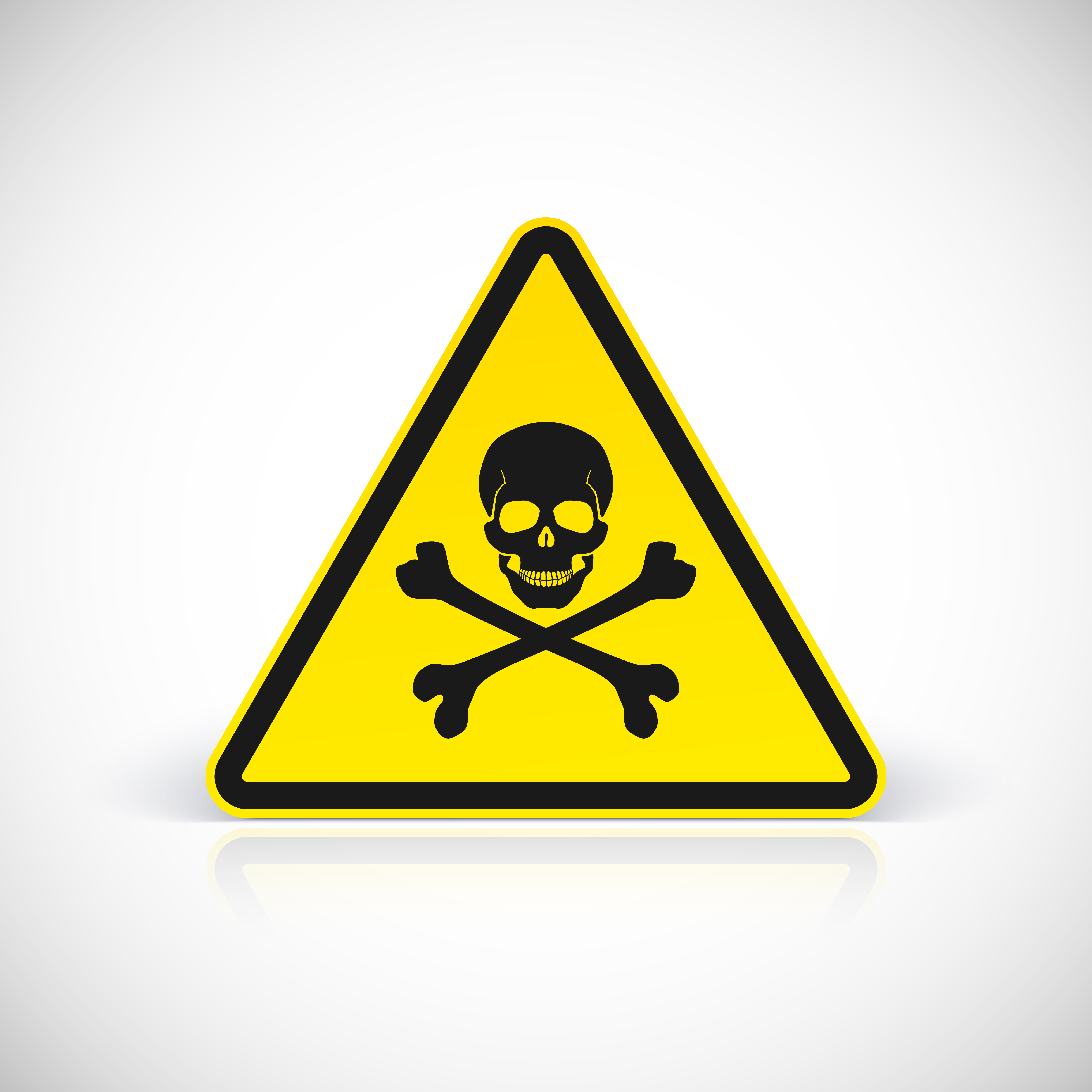 Triangular black and yellow poison warning sign with skull and crossbones.